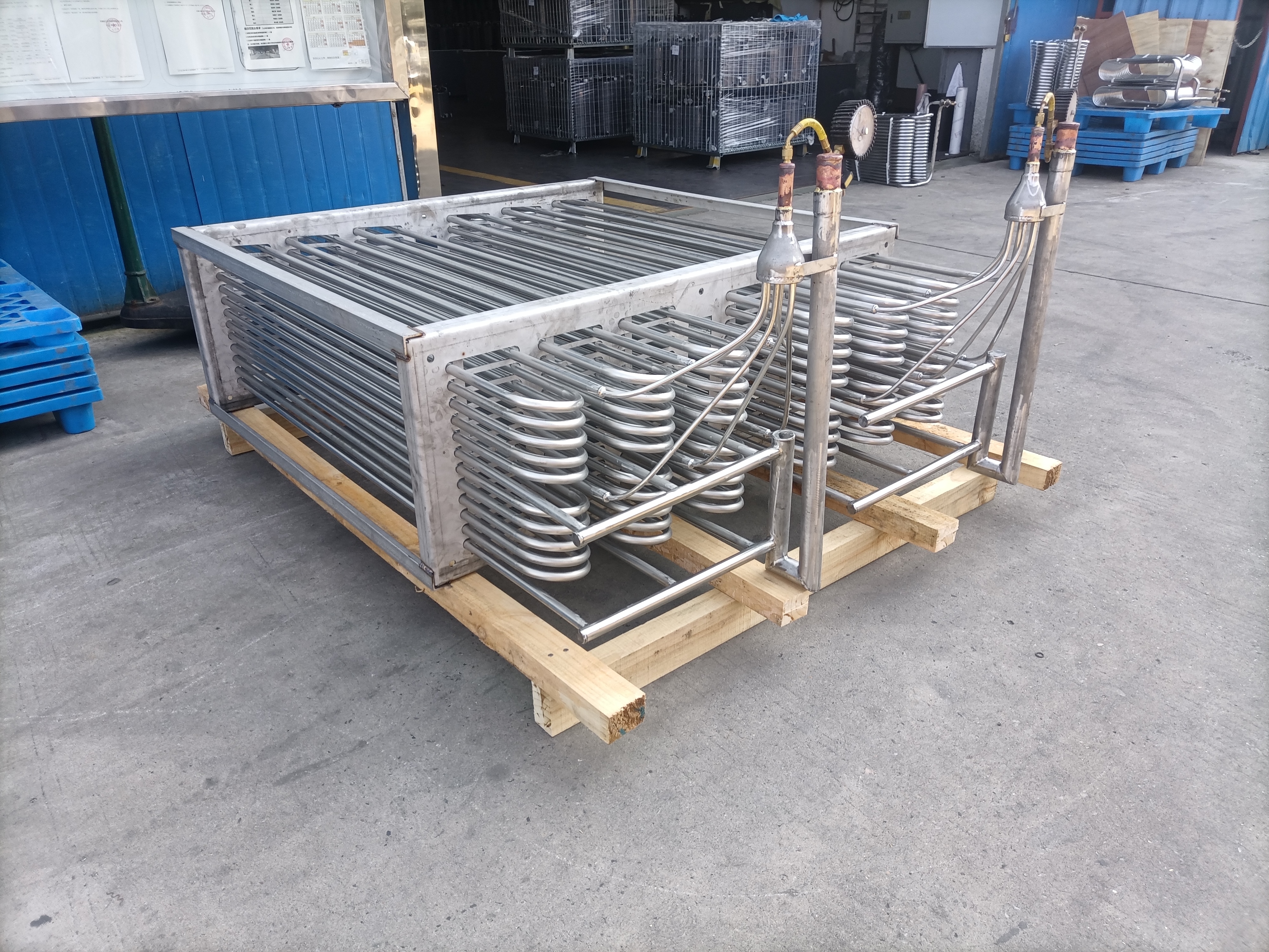 What is the advantage of the titanium coil heat exchanger?